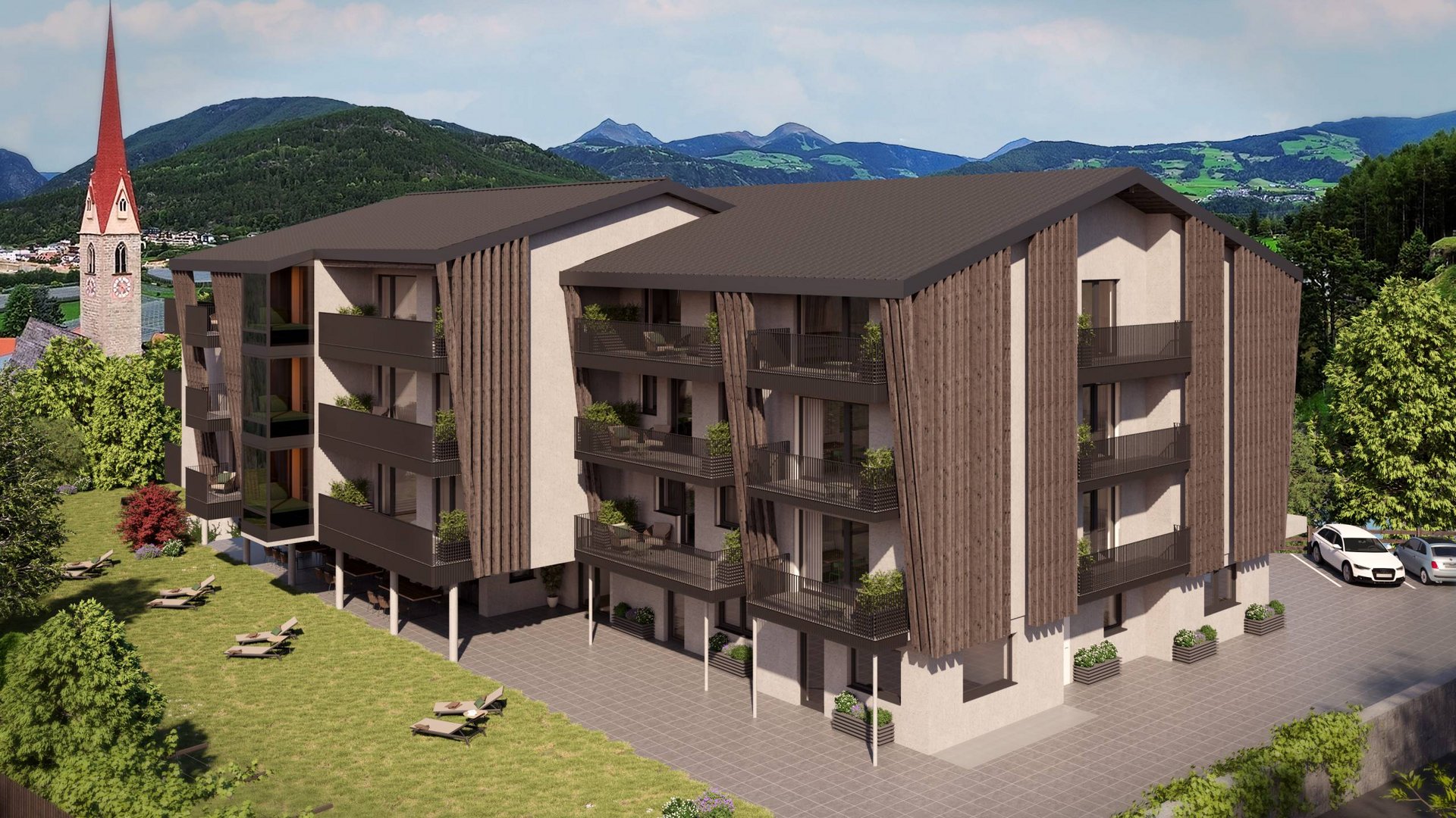 Moderner mehrstöckiger Neubau mit Balkonen in einer grünen Berglandschaft